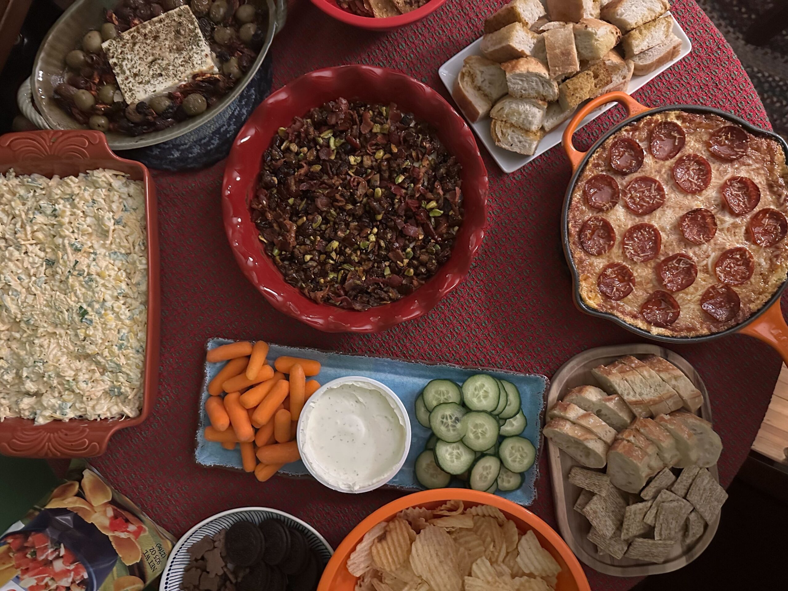 overhead table view of several delicious dips.